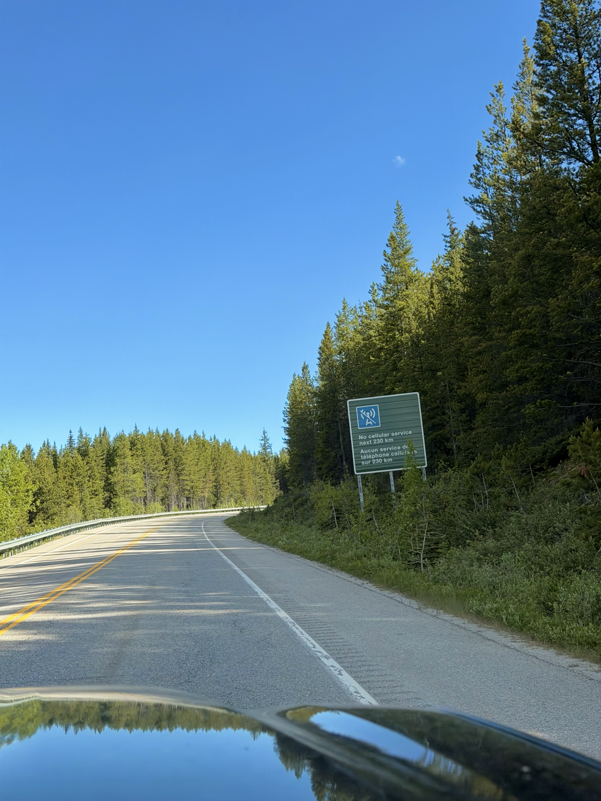 roadside sign warning of no cellular service in Canada