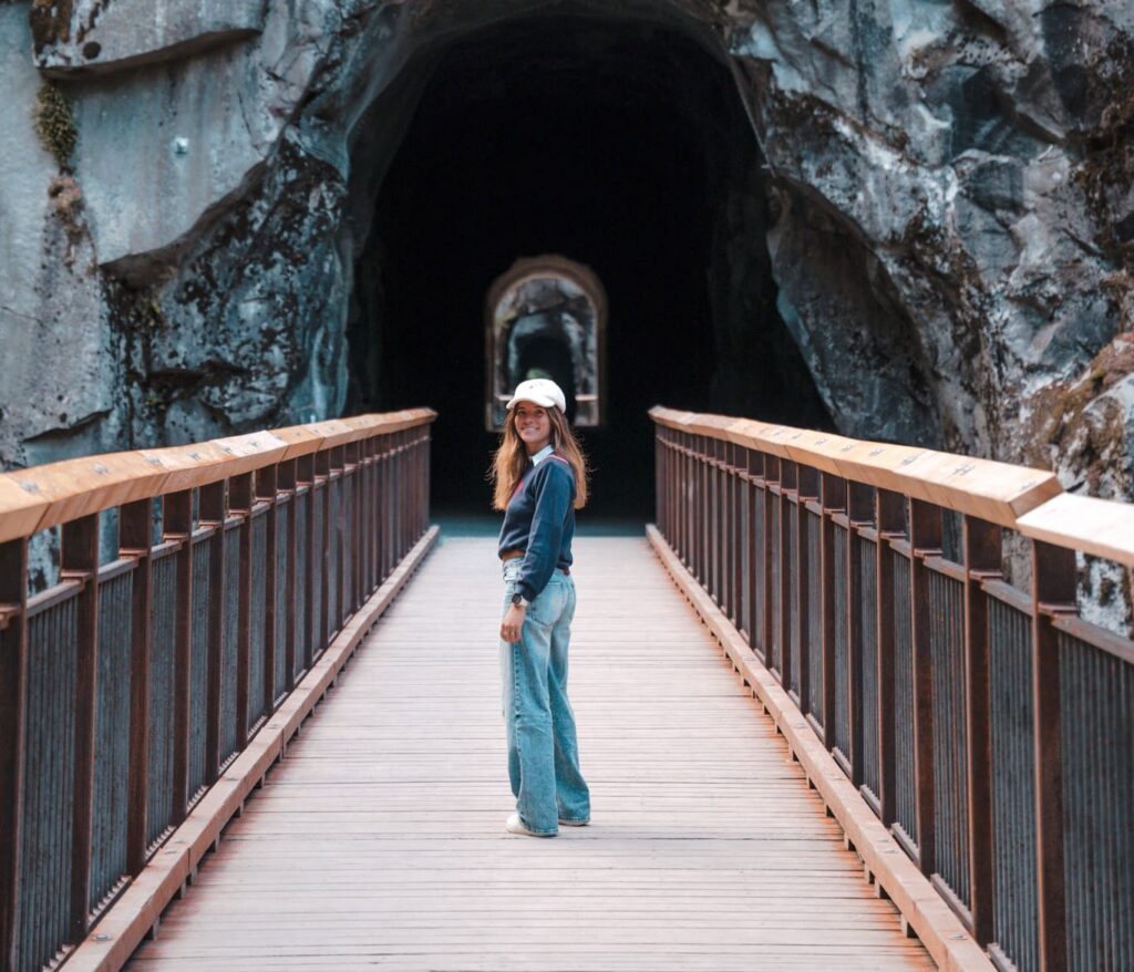 woman on wooden bridge leading to Othello Tunnels